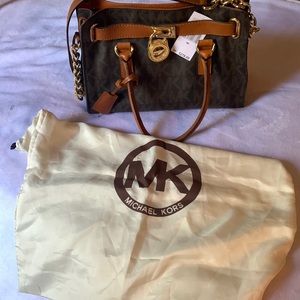 Sold!  Authentic Michael Kors women hand bag with logo and case